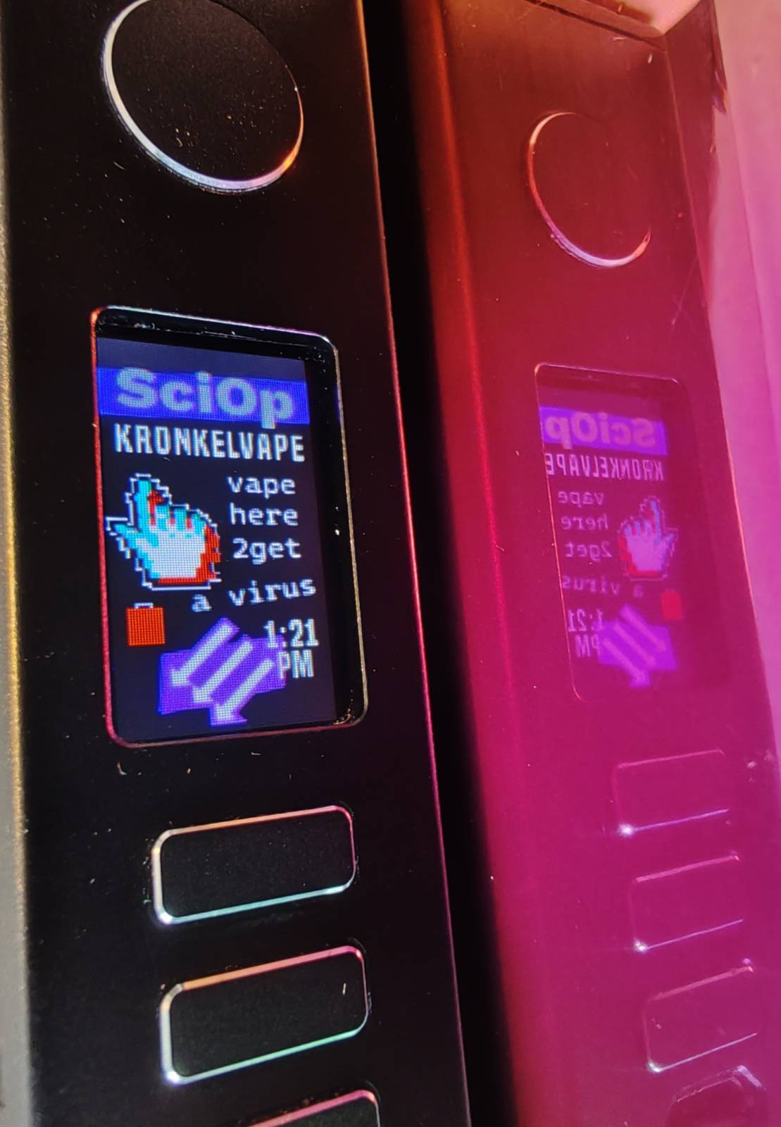 A nicotine vaporizer whose screen has the SciOp lettermark, subtitled "kronkelvape". It invites the user to "vape here 2 get a virus" with an RGB shifted pointer finger. the three arrows sciop logo is at bottom.